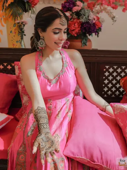 The bride showing off her beautiful mehndi design during her ceremony in Jaipur.