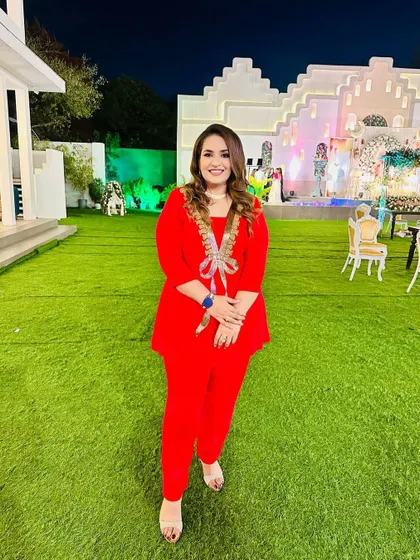 Another shot of the vibrant red co-ord set, perfect for making a statement at any celebration. More colors are available at my studio.