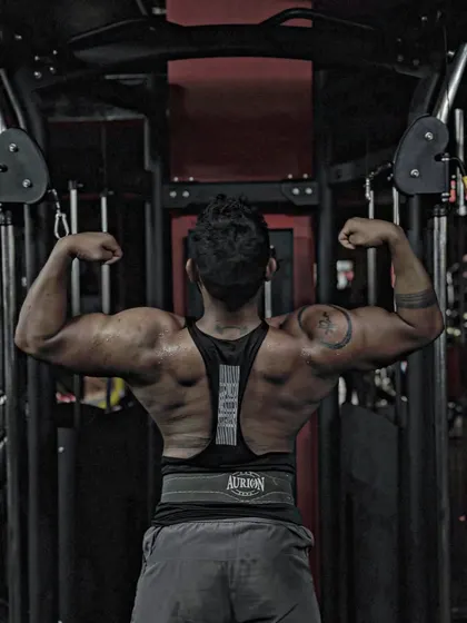 Spread your wings. A classic lat spread pose, showing the width of my back. This pose is all about creating an illusion of size.