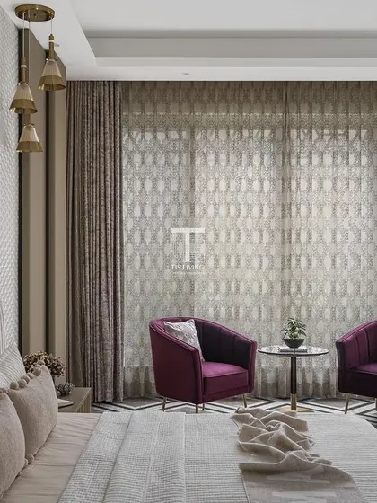 A wider view of the bedroom with 3D wall paneling, showing the cozy seating nook we created with two custom-made armchairs. This adds another layer of function and comfort to the master suite.