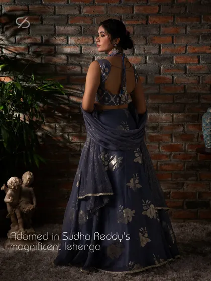 Adorned in my magnificent lavender lehenga, this view showcases the elegant back design of the blouse and the flow of the organza skirt.