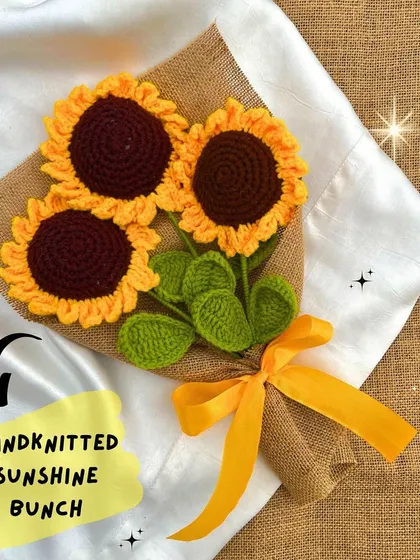 Our hand-knitted sunshine bunch, featuring three beautiful crochet sunflowers wrapped in jute. It's a simple, rustic, and heartwarming gift.