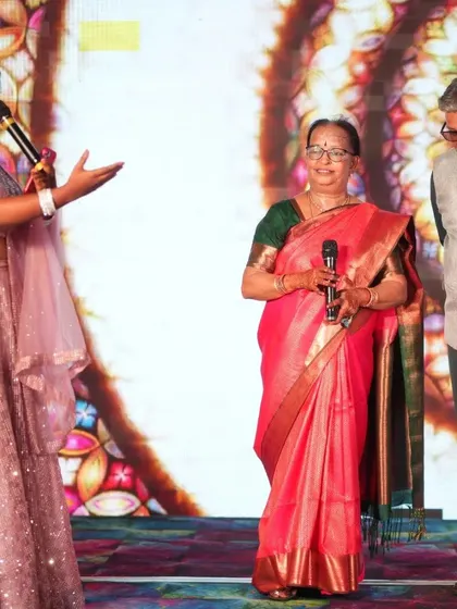 Our host speaking with the parents on stage, giving them a special moment to share their blessings and stories. We make sure to honor the elders in the family.