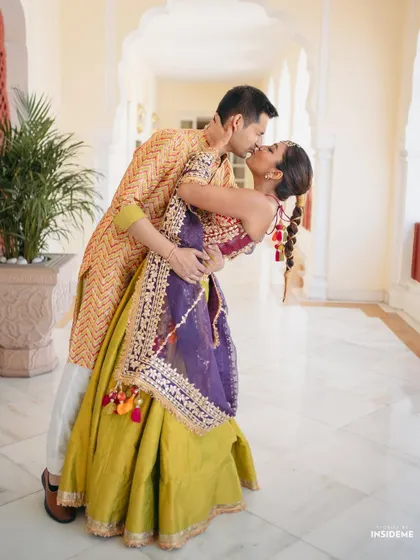A dramatic and romantic dip. This shot captures the fun and energy of the couple and the beautiful movement of Mishi's outfit.