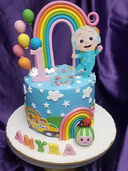 Another joyful Cocomelon cake, this time celebrating a first birthday with rainbows, balloons, and the whole Cocomelon crew. The bright colors make it a perfect party centerpiece.