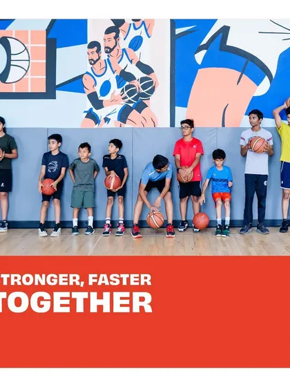Stronger, Faster, Together. Our summer camp kids posing in front of our mural.
