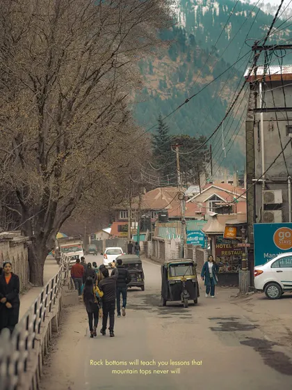 The walk to the mall road in Manali. This image captures the everyday life in the hill station, with its mix of locals, tourists, and unique architecture.