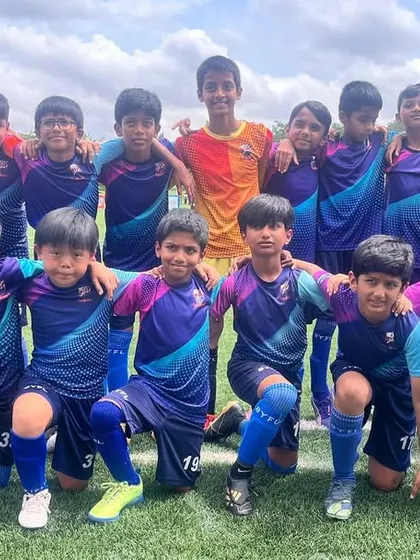 The U11 team and their coach on Day 2 of the DPDL Super Cup.