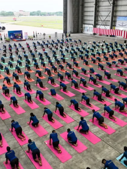A large group of naval personnel practicing a variation of Vajrasana. The uniformity and dedication on display are truly commendable.