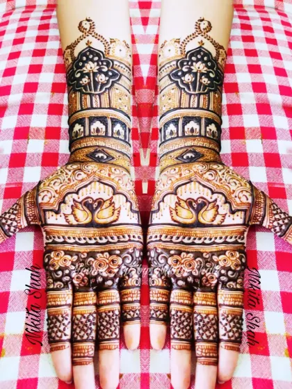 Symmetrical swan designs for a bride's sister. This is a perfect example of a full, festive look suitable for close family members.