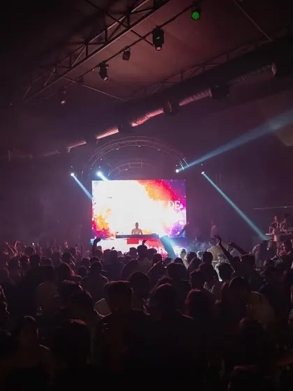 A wide shot of my audio-visual show at Elrow Pune. The large LED screen behind me displays custom graphics that are synced live with the music I'm playing.