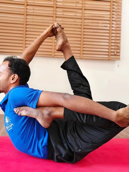 A deep reclining backbend that showcases advanced flexibility and control.
