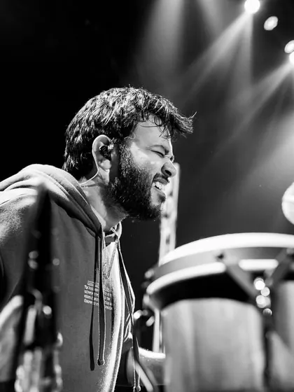A black and white shot capturing the intensity of a live performance. Every beat comes from the heart, and I'm completely focused on delivering a powerful show.