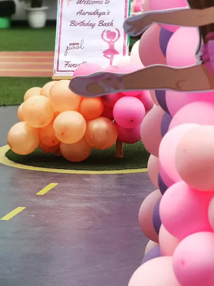 The welcome sign for Aaradhya's Ballerina birthday bash. The pink and purple balloons perfectly match the graceful theme.