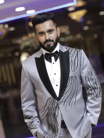 Our silver-grey tuxedo is a modern classic. The abstract black embroidery adds a contemporary edge, perfect for a man with a keen sense of style.