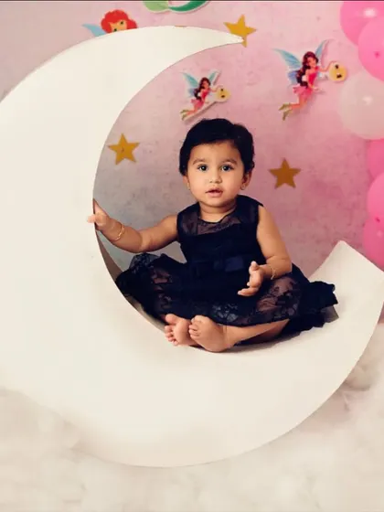 Another angle of our little moon-sitter, showing the delicate details of the fairy backdrop and her sweet dress.