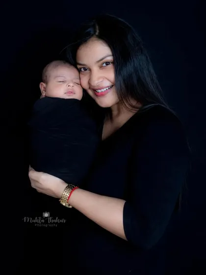 A mother's smile says it all. She is so in love with her new baby, and it was an honor to photograph this moment.