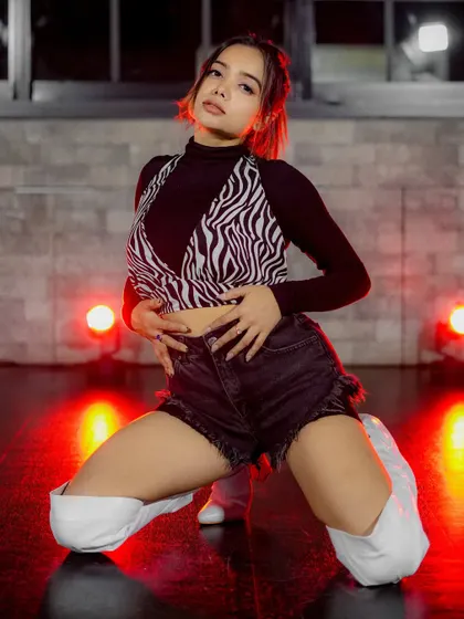 A powerful, direct-to-camera pose that completes this edgy dance-style set.