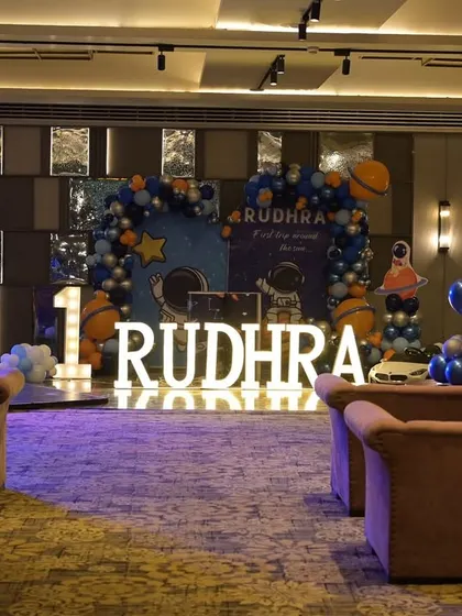 A wide shot of the venue, showing how we used balloon arrangements and lighting to create a cosmic atmosphere throughout the room.