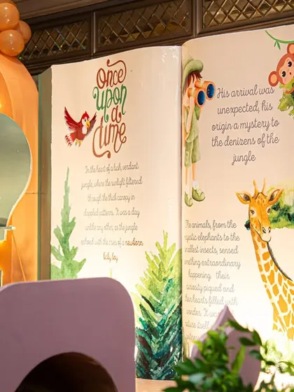 The centerpiece of Ved's party was this incredible storybook backdrop, telling a custom tale about his jungle adventure. This is a perfect example of how I weave personal stories into my event designs.