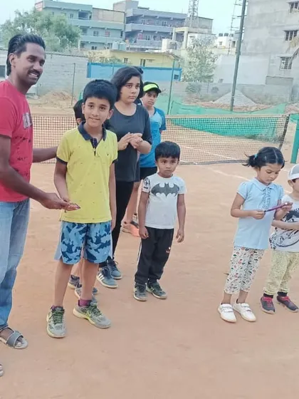 A candid moment with the group. Coaching kids of different ages together helps the younger ones learn by watching, and the older ones develop leadership skills.