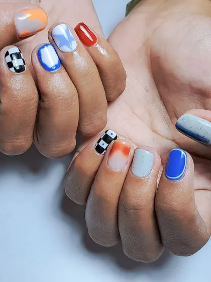 A fun, mismatched set for when you can't decide on a vibe. This features hand-painted checkerboard, abstract blue and white, and a pop of red.