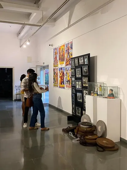 Visitors looking at the large vintage movie posters.