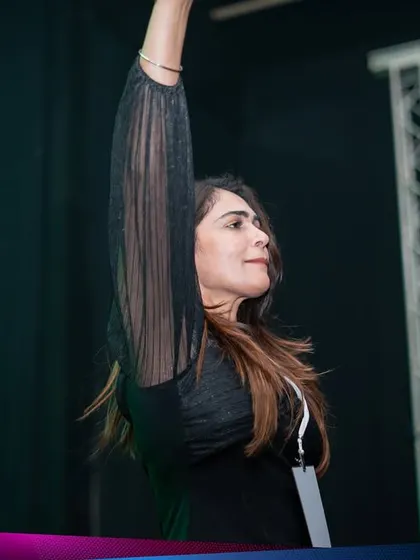 A profile shot of me with my hand raised, connecting with the festival crowd in Sri Lanka. It's about creating a personal connection, even with an audience of thousands.