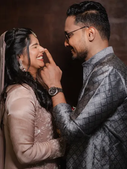 It's the playful, silly moments that you'll cherish forever. This groom's gentle tease brings out a beautiful, natural laugh from his bride.