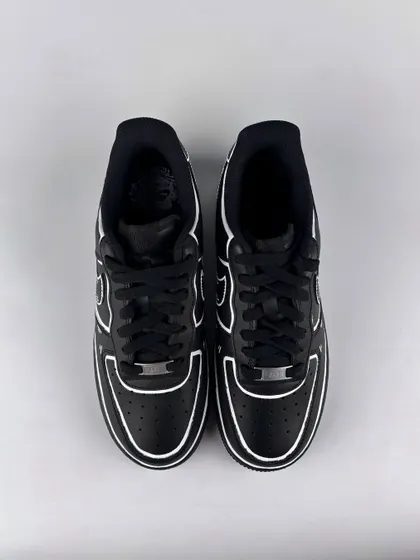 A front view of the black cartoon custom sneakers.