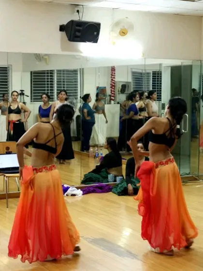 Dancers practice their choreography in front of the mirror during our Indian Fusion Weekender. The intensive format allows for focused learning and significant progress in a short time.