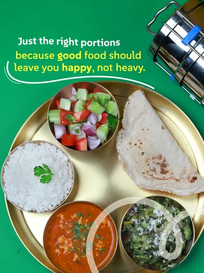 Just the right portions because good food should leave you happy, not heavy. A balanced meal of paneer bhurji, sabzi, rice, roti, and salad.