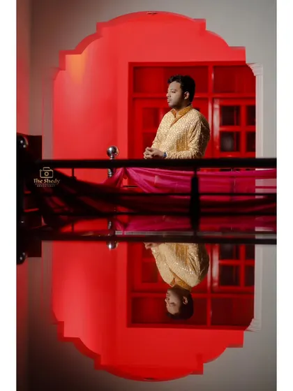 A reflection shot of the groom, Advocate Saqib, during his Haldi. We love using reflections to add a creative and unique perspective to our photos.