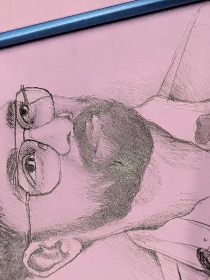 A detail shot focusing on the challenging angles of the glasses and the texture of the beard in this pencil sketch.