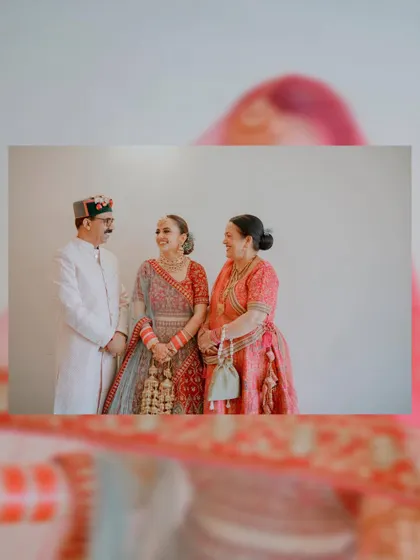 A happy, candid moment between the bride and her parents. These are the unposed, genuine interactions that make a wedding album special.