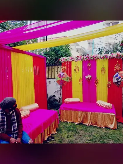 For traditional ceremonies like Mehandi, I provide low seating options like mattresses with bolsters, set up on the grass for a relaxed feel.