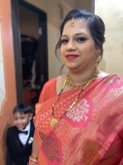 A happy client ready for her event. Even with a little photobomber, her radiant look shines through.