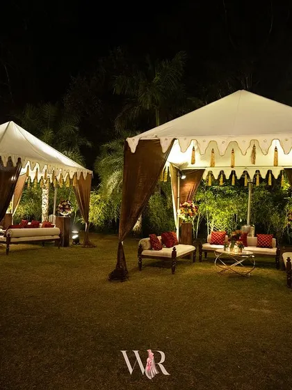 Jodhpur-inspired tents provided a regal and intimate seating option in the garden. Draped in brown velvet, they offered a cozy escape for guests, complete with plush seating and floral arrangements.