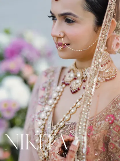 A soft and elegant close-up of the bride, capturing the delicate details of her outfit and jewelry.
