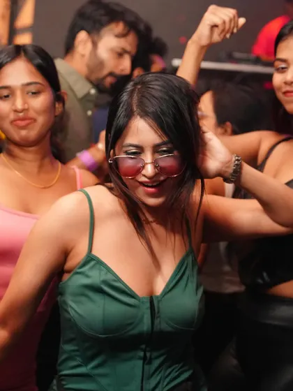 A stylish and happy partygoer.