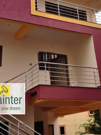 A bold exterior color scheme with deep red textured paint and yellow accents. This gives the building a unique and vibrant look.