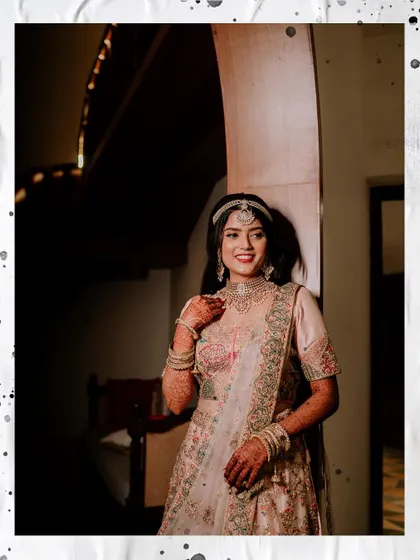 A beautiful portrait of the bride on her Sangeet day, with a soft, artistic frame.