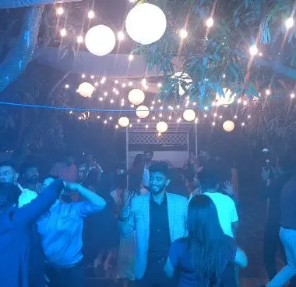 The dance floor is packed at this stylish outdoor wedding.
