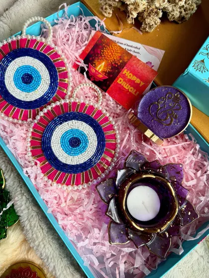 An evil-eye themed Diwali hamper, blending traditional motifs with modern protection symbols.
