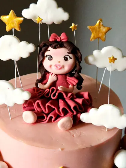A close-up of the princess figurine from the first birthday cake, showing the detail in her ruffled dress and curly hair.