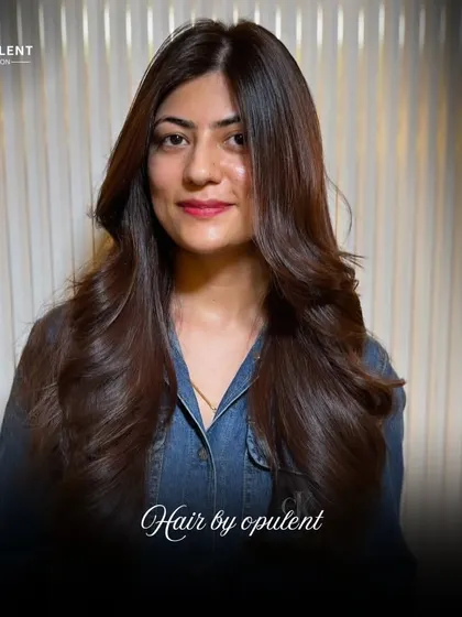 A beautiful, classic long-layered haircut. The soft, cascading layers create movement and prevent long hair from looking heavy.