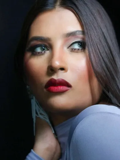 The color version of the portfolio look, featuring a classic winged liner and a bold red lip.