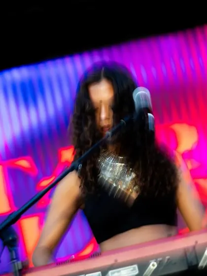 A collaborating artist lost in the music on the keyboard. The live instrumentals are a key part of what makes the Basement Bhangra sound so rich and dynamic.
