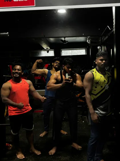 Don't mess with us. A casual flex with the boys after a hard training session. This is the confidence that comes from being part of a strong team.