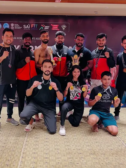 Our fighters showcasing their hard-earned medals. We train athletes for various kickboxing categories, including Point Fight and Kick Light, leading to multiple wins.